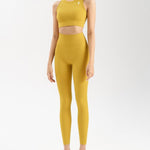front side of women's activewear set in mustard yellow