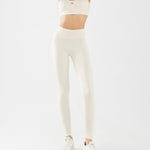 front side of women's sports bra and high waisted legging in white