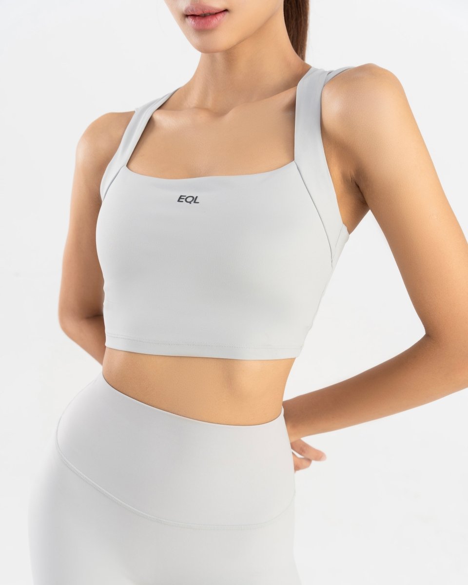 close up front side of women's sports bra  in grey