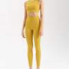 front side of women's activewear set in mustard yellow